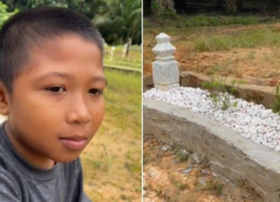 Viral! Seorang Bocah Laki-laki Kumpulkan Batu Bata Untuk Lindungi Makam Sang Ayah Dari Banjir